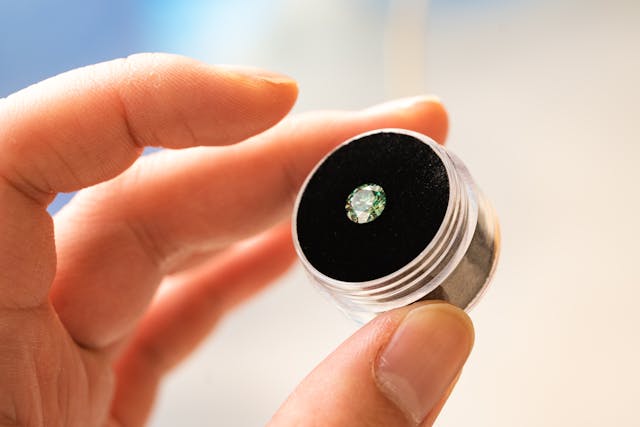 person holding a diamond